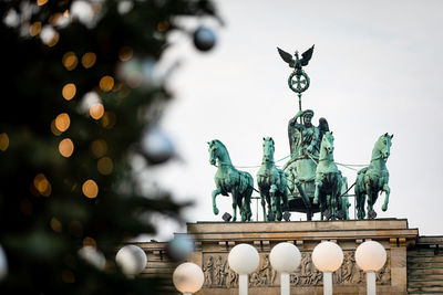 Low angle view of statue against sky