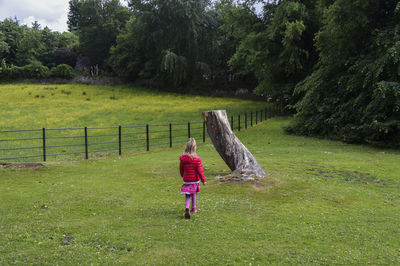 Rear view of woman on field