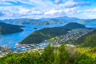 Scenic view of sea and mountains against sky