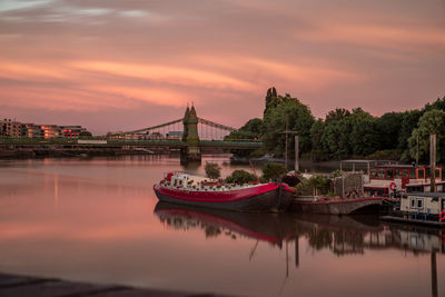 View of bridge over river against cloudy sky