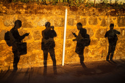 Shadow of people standing on floor at night