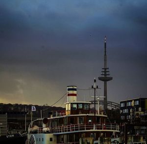 Cityscape against cloudy sky