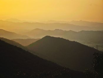 Scenic view of mountains against sky during sunset