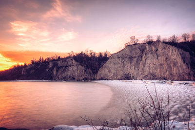 Scenic view of mountains against sky at sunset