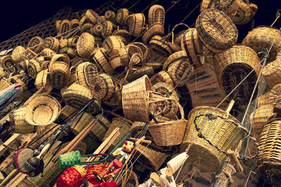 Low angle view of wicker objects for sale at market