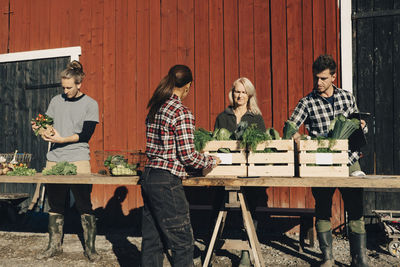 Group of people sitting on wooden table