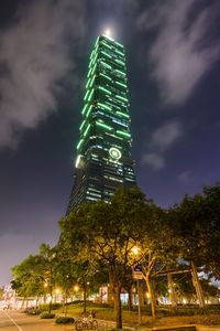 Low angle view of illuminated tree against sky at night