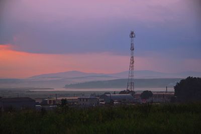 Scenic view of field against sky during sunset