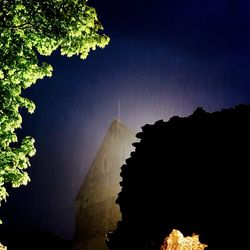 Scenic view of silhouette mountain against sky at night