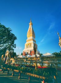 Low angle view of temple against blue sky