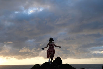 Low angle view of statue against sky during sunset