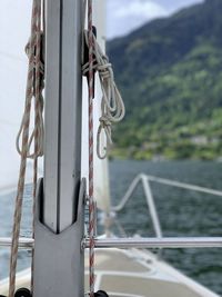 Close-up of rope tied to railing