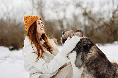 Portrait of young woman with dog