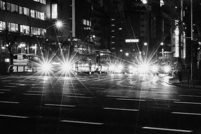 Illuminated city street at night