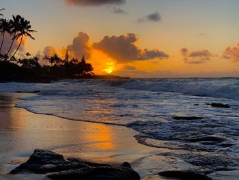Scenic view of sea against orange sky