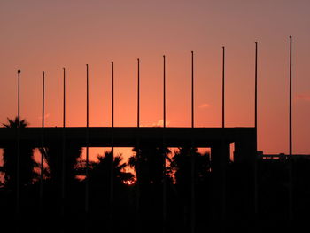 Silhouette plants against orange sky