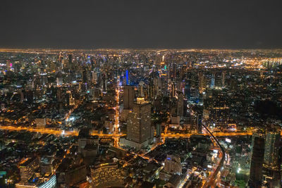 High angle view of illuminated cityscape at night