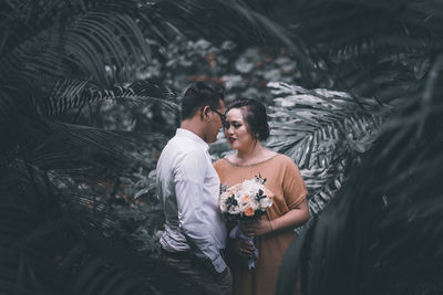 Young couple standing outdoors