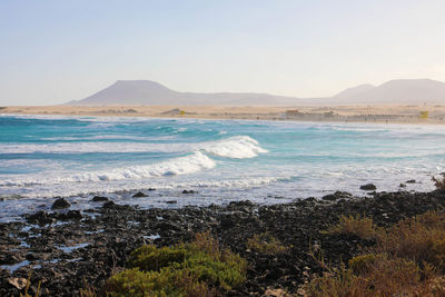 Scenic view of sea against clear sky