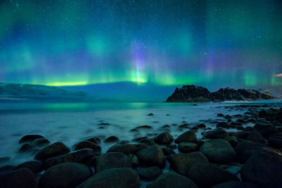 Scenic view of sea against sky at night