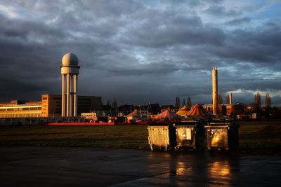 Illuminated buildings against sky at twilight