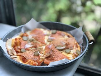 Close-up of pizza in bowl on table