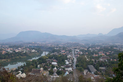 High angle view of townscape and mountains against sky