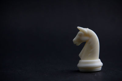 Close-up of stuffed toy over black background