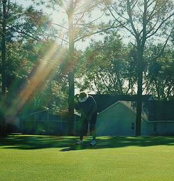 Man playing with golf course