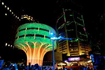 Low angle view of illuminated ferris wheel