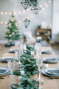 High angle view of christmas decorations with place setting on table