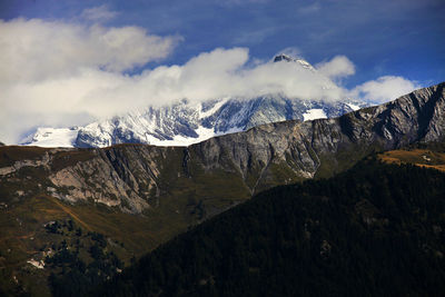 Scenic view of dolomites against sky during winter