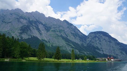 Scenic view of lake and mountains against sky