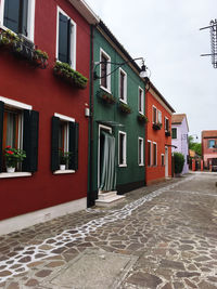 Alley amidst buildings in city