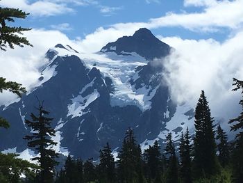 Scenic view of snowcapped mountains against sky