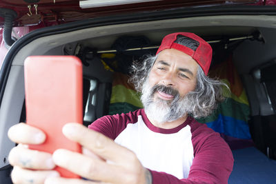 Portrait of young man in car