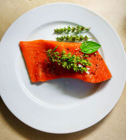 High angle view of fish in plate on table