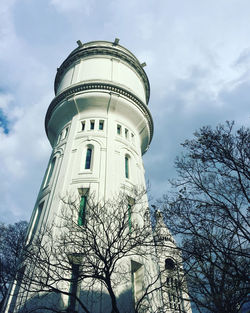 Low angle view of tower against cloudy sky