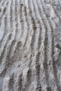 Full frame shot of tracks on sand