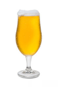 Close-up of beer glass against white background