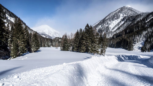 Scenic view of snowcapped mountains against sky