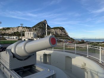Large gun at europa point in gibraltar, with the rock in the background 