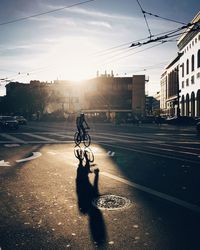 Man riding bicycle on street in city