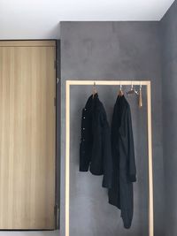 Close-up of clothes hanging on wall
