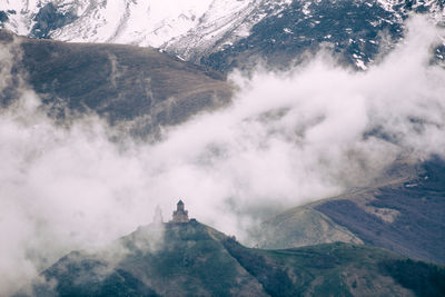 View of mountain range in foggy weather