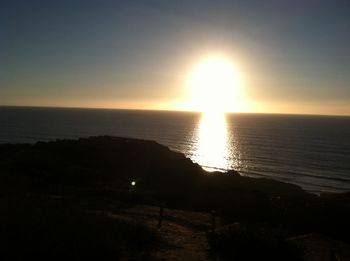 Scenic view of sea against clear sky during sunset