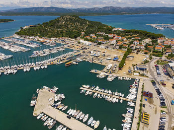 High angle view of harbor and buildings in city