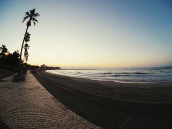 Scenic view of beach at sunset