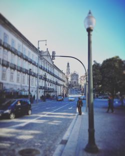 People walking on road in city