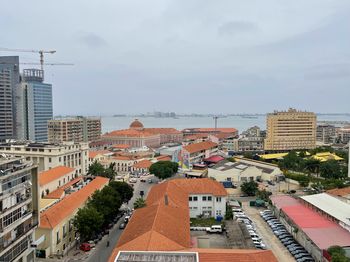 High angle view of buildings in city against sky